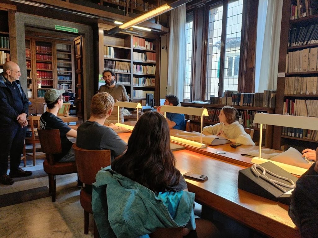 Students and professors gather to view Galileo Galilee's manuscripts at the National Central Library of Florence