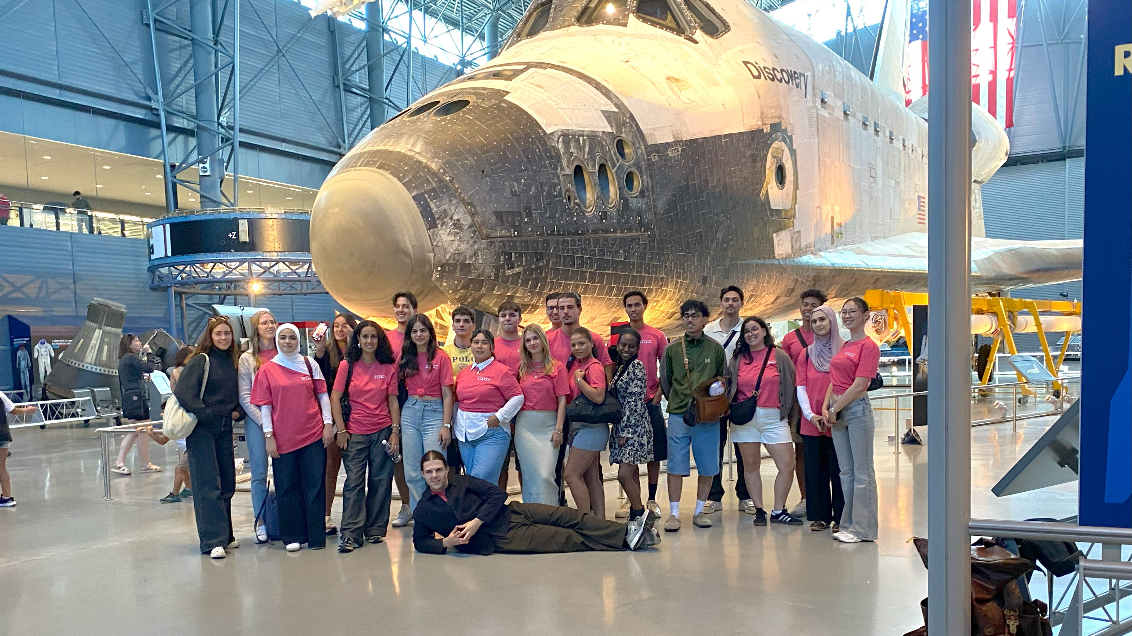 German students gather in front of the Discovery space shuttle at the Smithsonian Air and Space museum