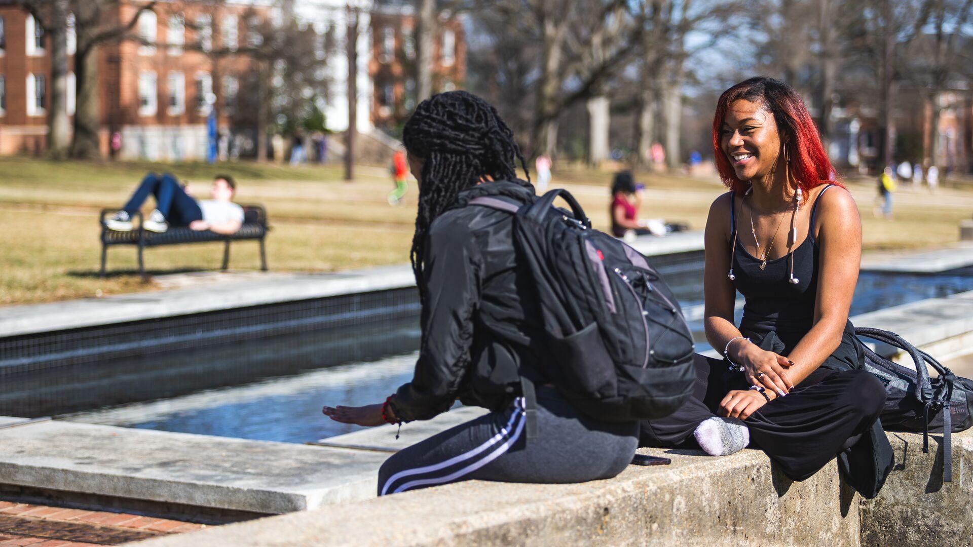 Students outdoors on the Mall on an unseasonably warm February day.