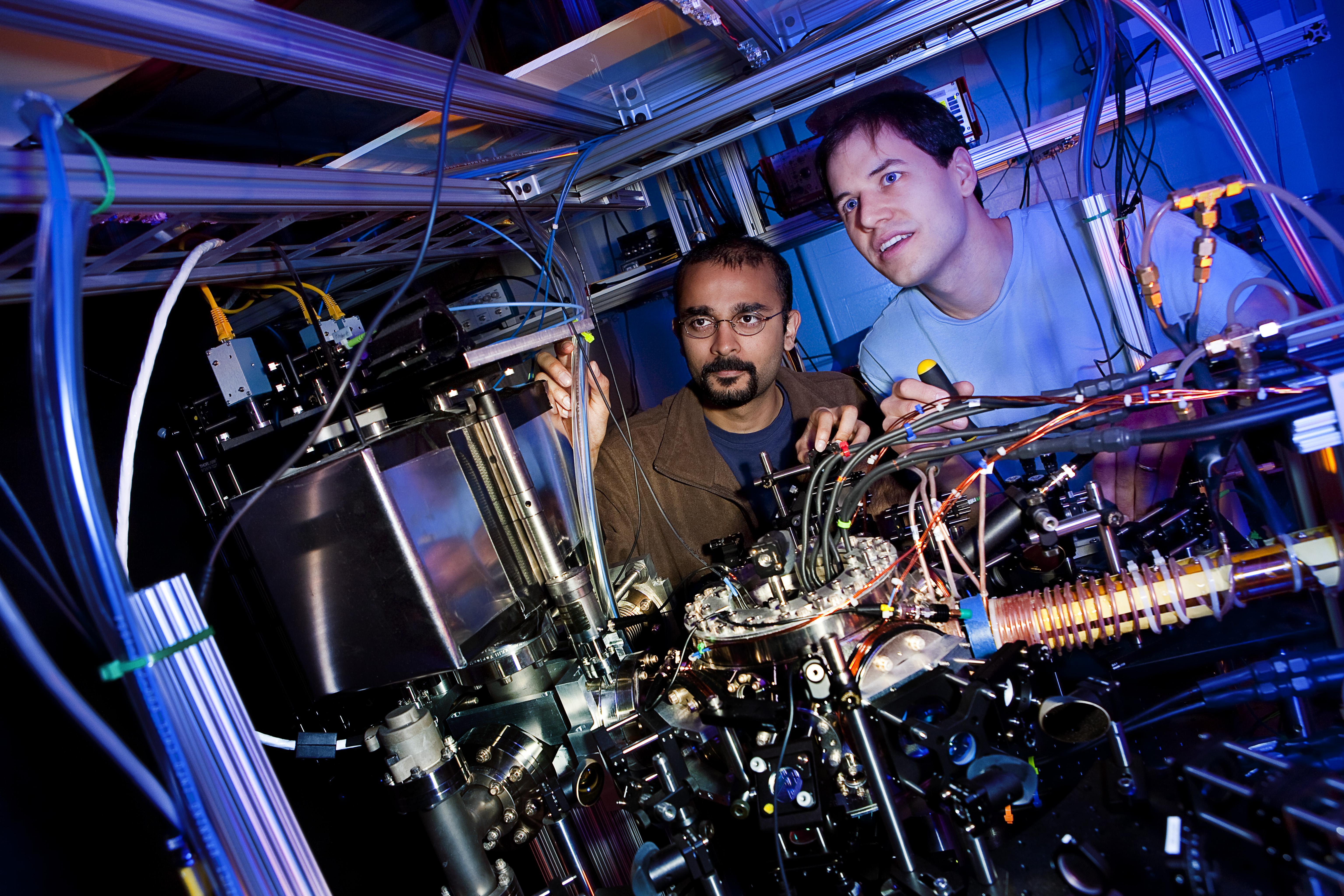 Student & professor pose in lab.