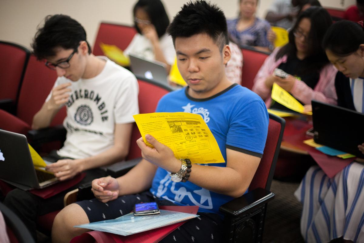 Students look over a flyer.