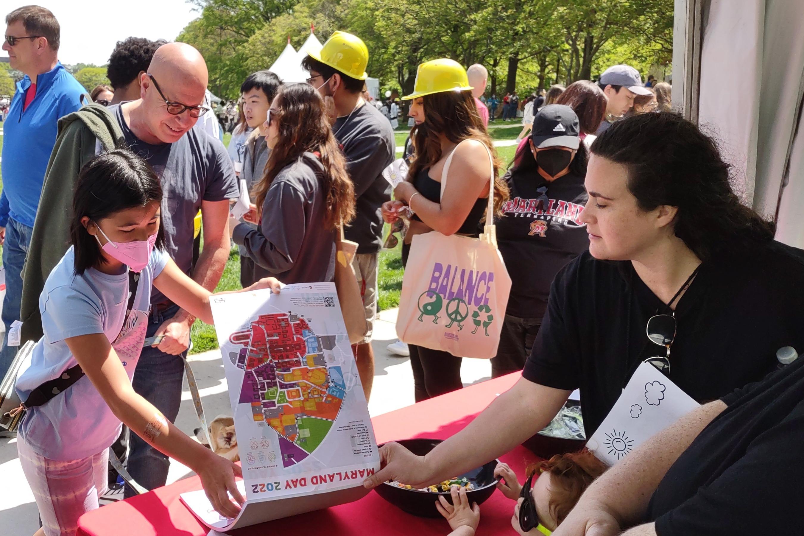 Director Ross D. Lewin overlooks a booth at Maryland Day.