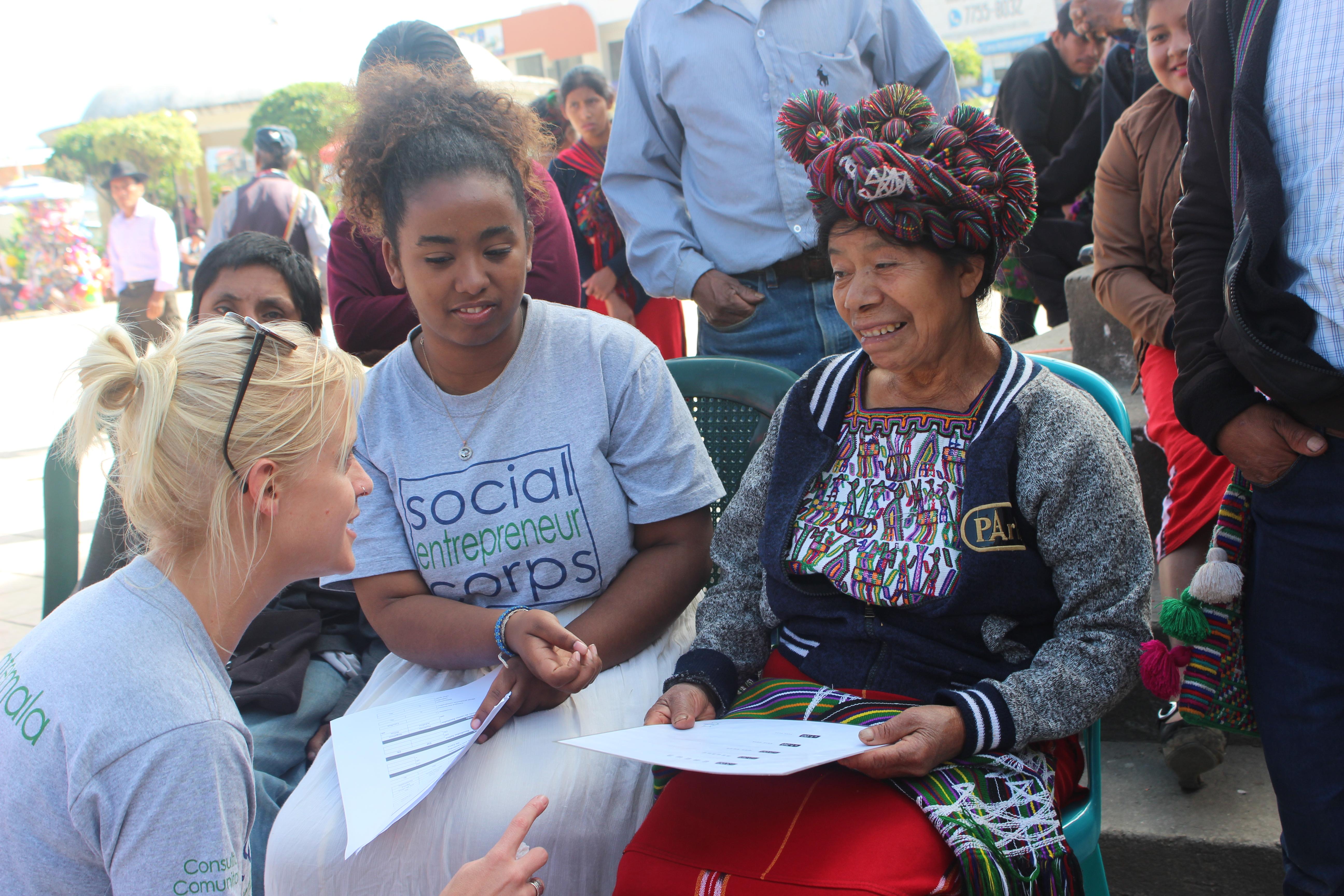 Maryland students sit with locals in Guatemala.