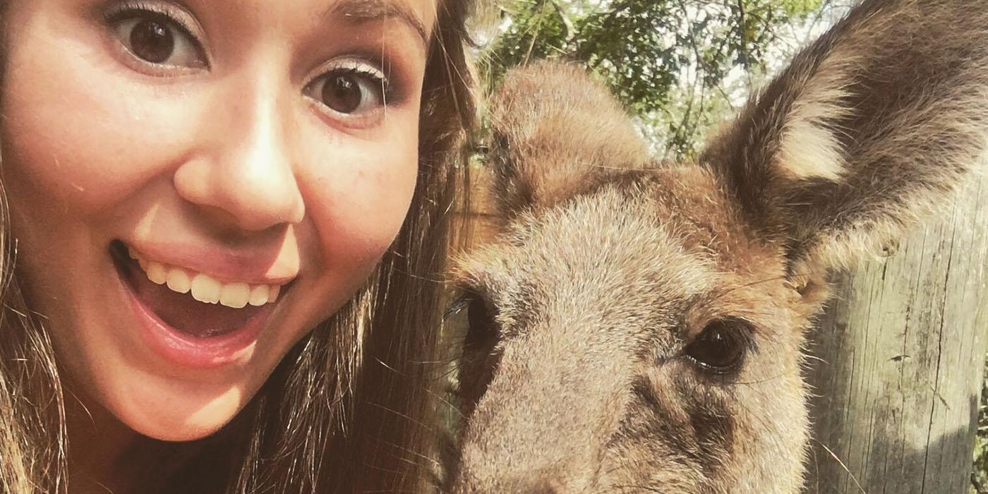 Briana posing next to a kangaroo