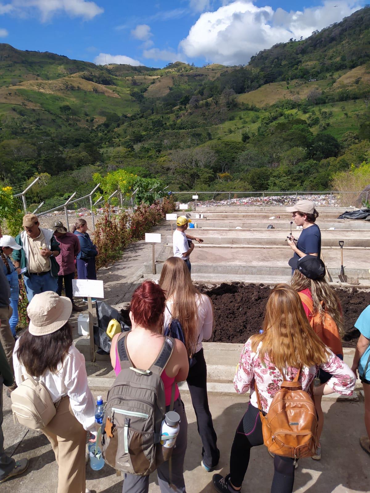 A group of students tour a facility on a study abroad trip.