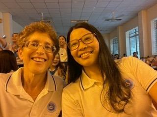 Dr. Susan De La Paz poses with a student in Vietnam.
