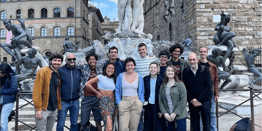 Group of 13 students and faculty in front of the Fountain of Neptune in Florence, Italy