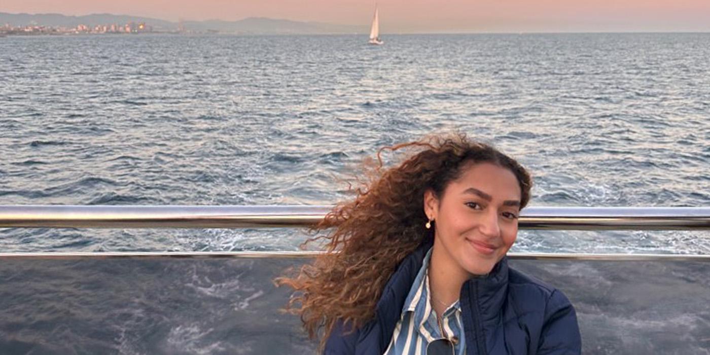 Katherine Badia on a boat at sunset in Barcelona