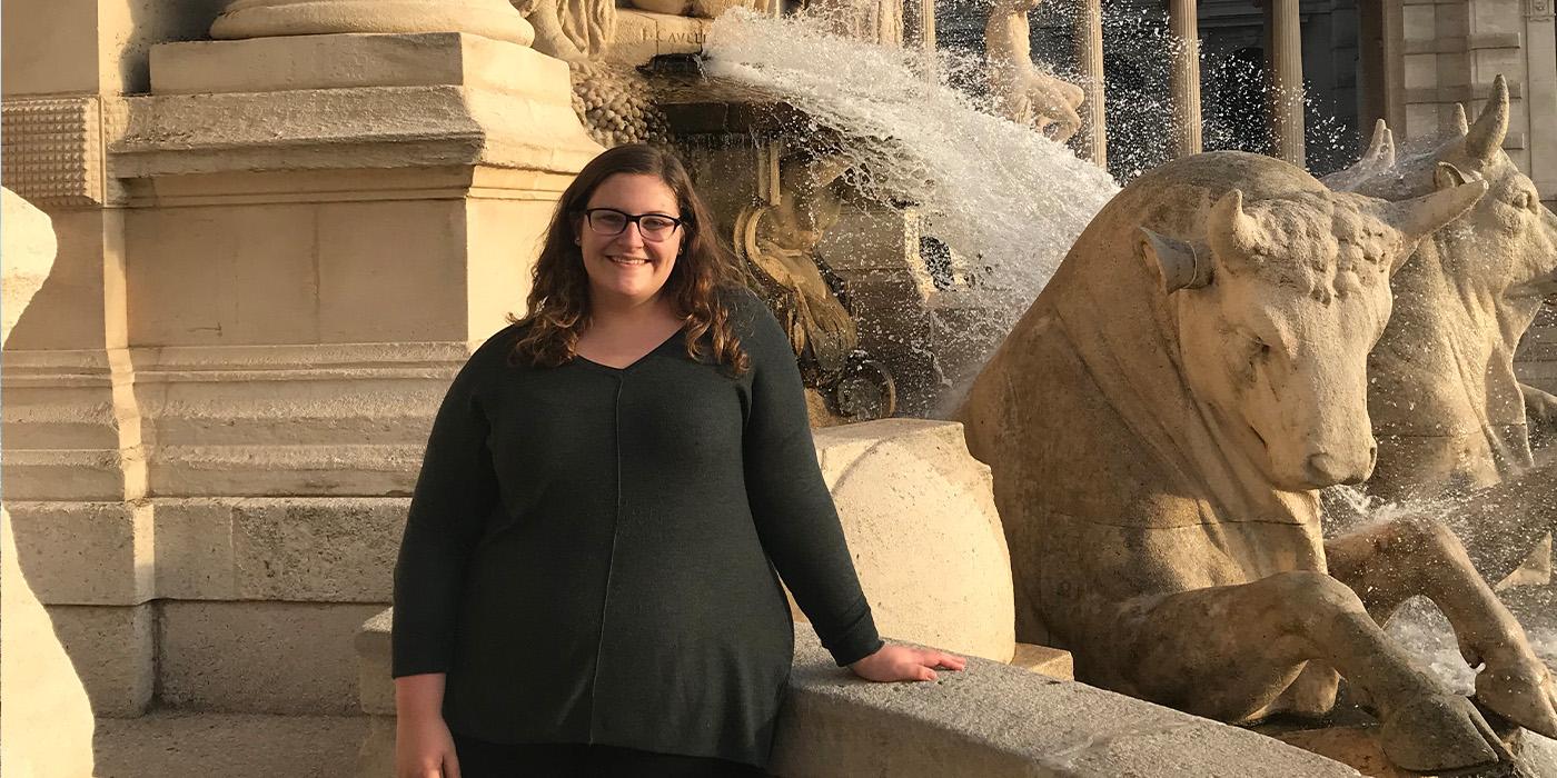 Madeline Case poses in front of a bull statue and fountain at the Palais Longchamp in Marseille