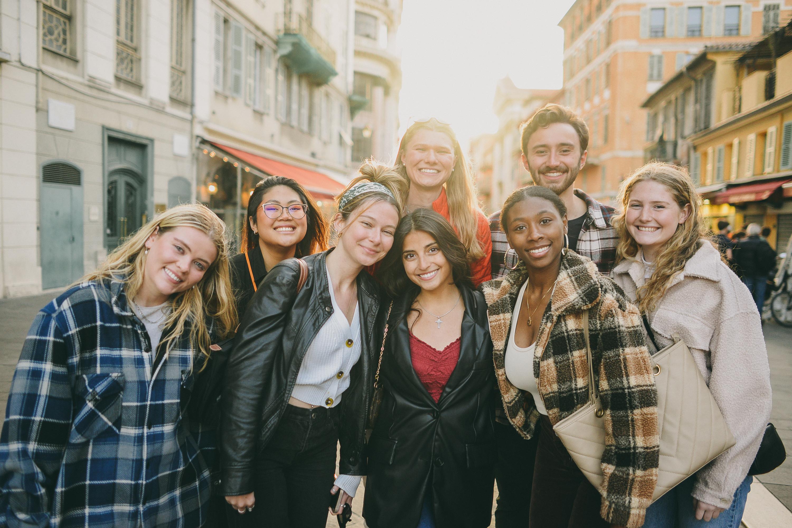 Students stand together on a street in Nice