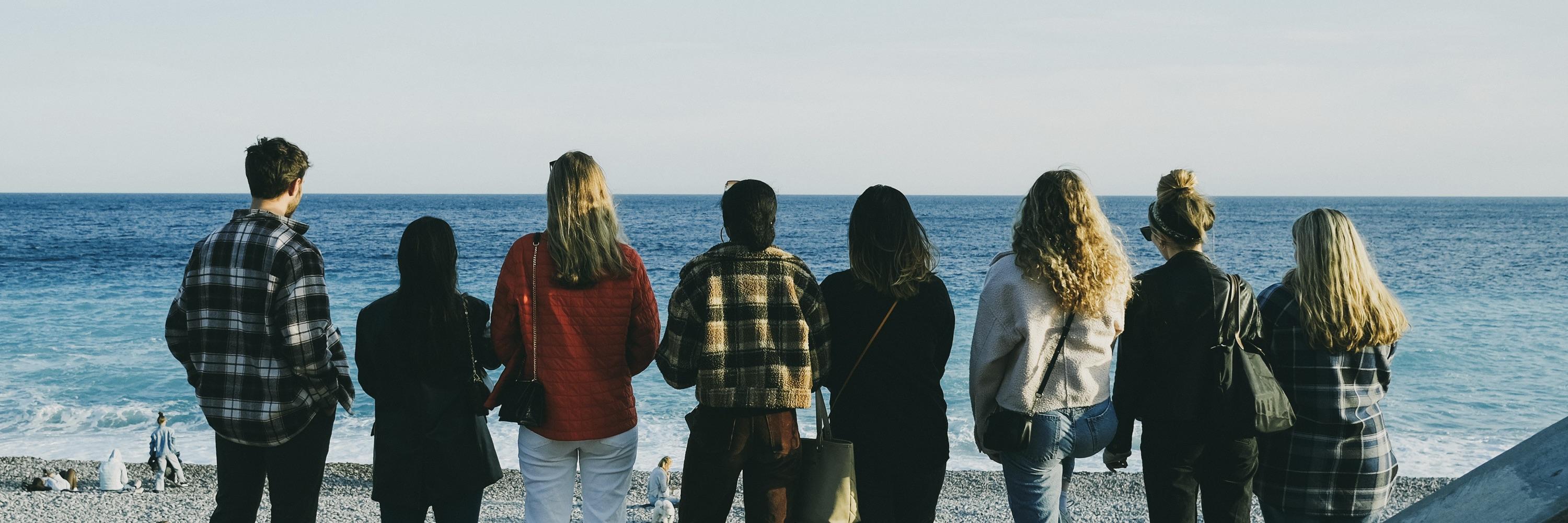 Eight students look out into the Mediterranean Sea from the shore in Nice, France.