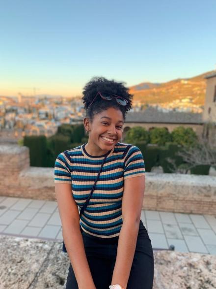 Student smiles at an overlook in Madrid, Spain. 