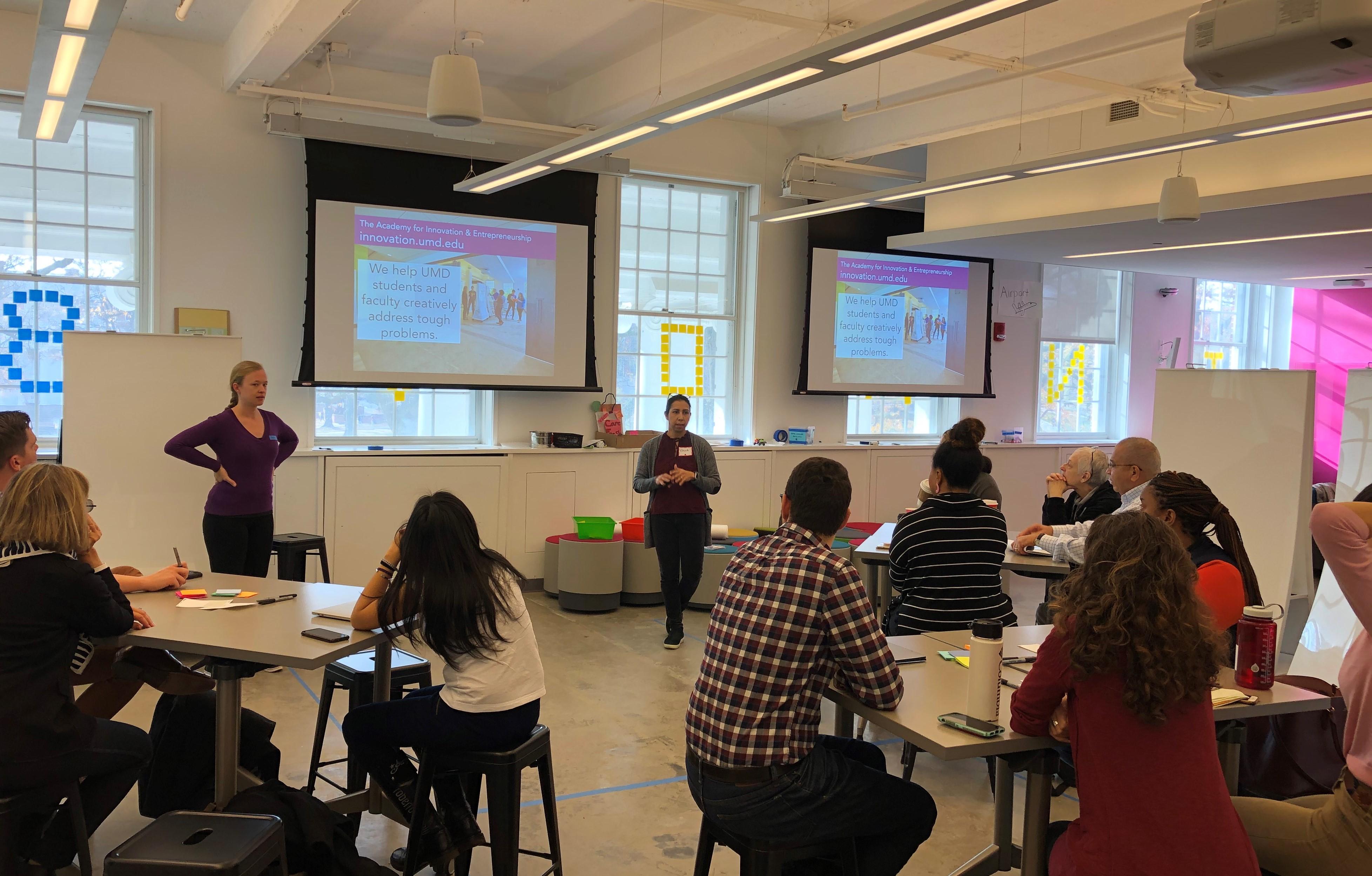 Instructors presenting to an audience during a workshop.