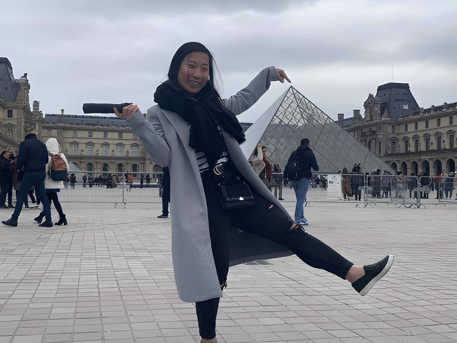 Angie Lee '21 poses in front of the Louvre in Paris, France.