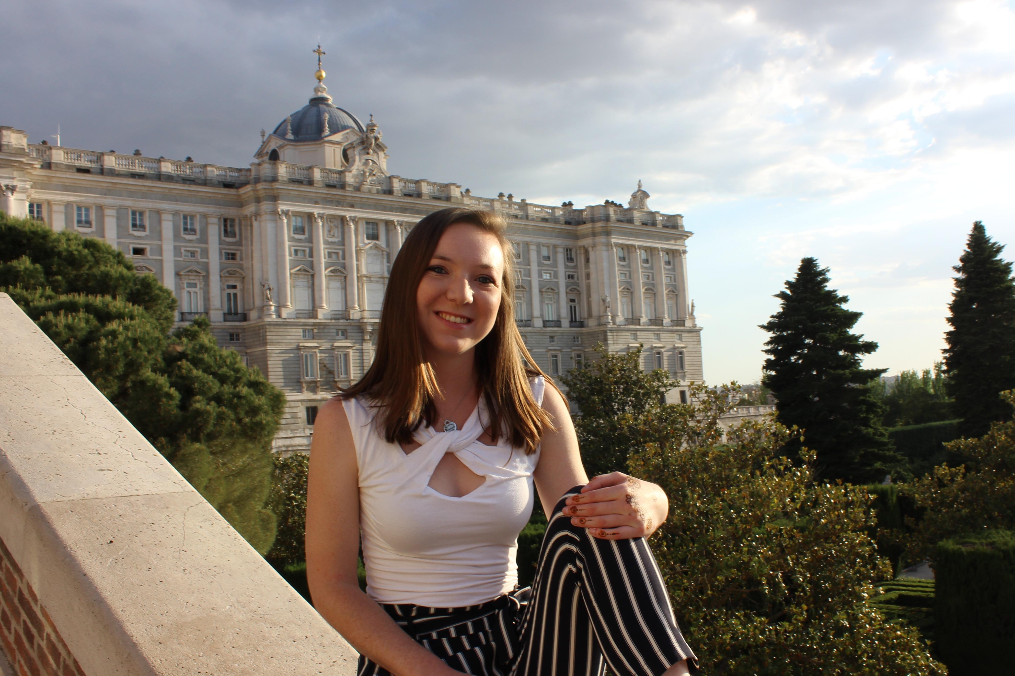 Student poses overlooking Versailles.