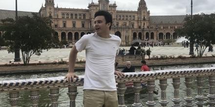 Michael stands on a bridge in Spain