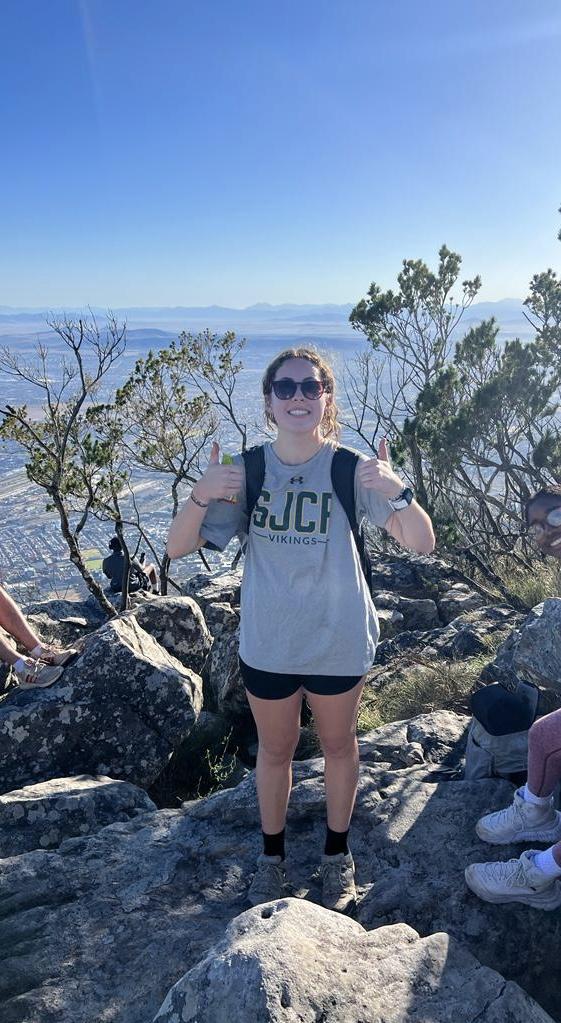 Elana Naide at the summit of a hike