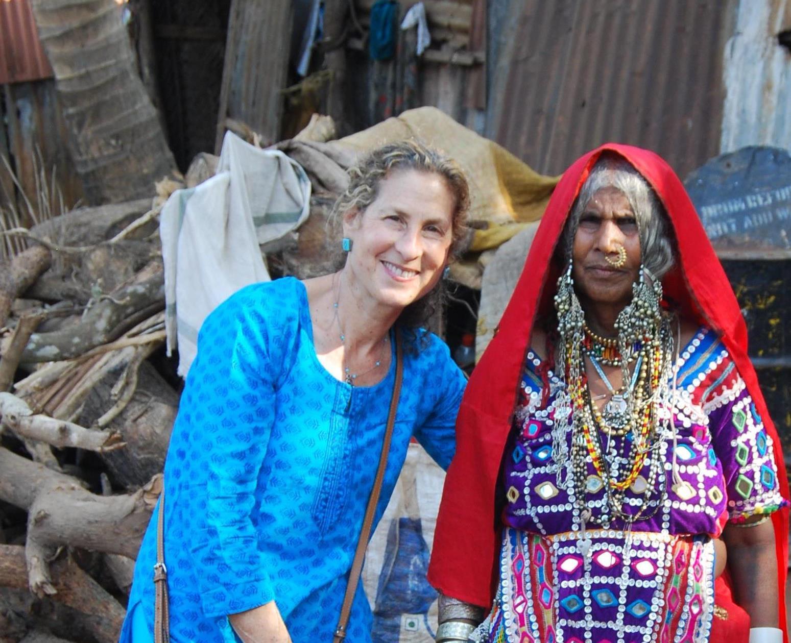 Dr. Donna Howard (left) poses with a village elder in India (right).
