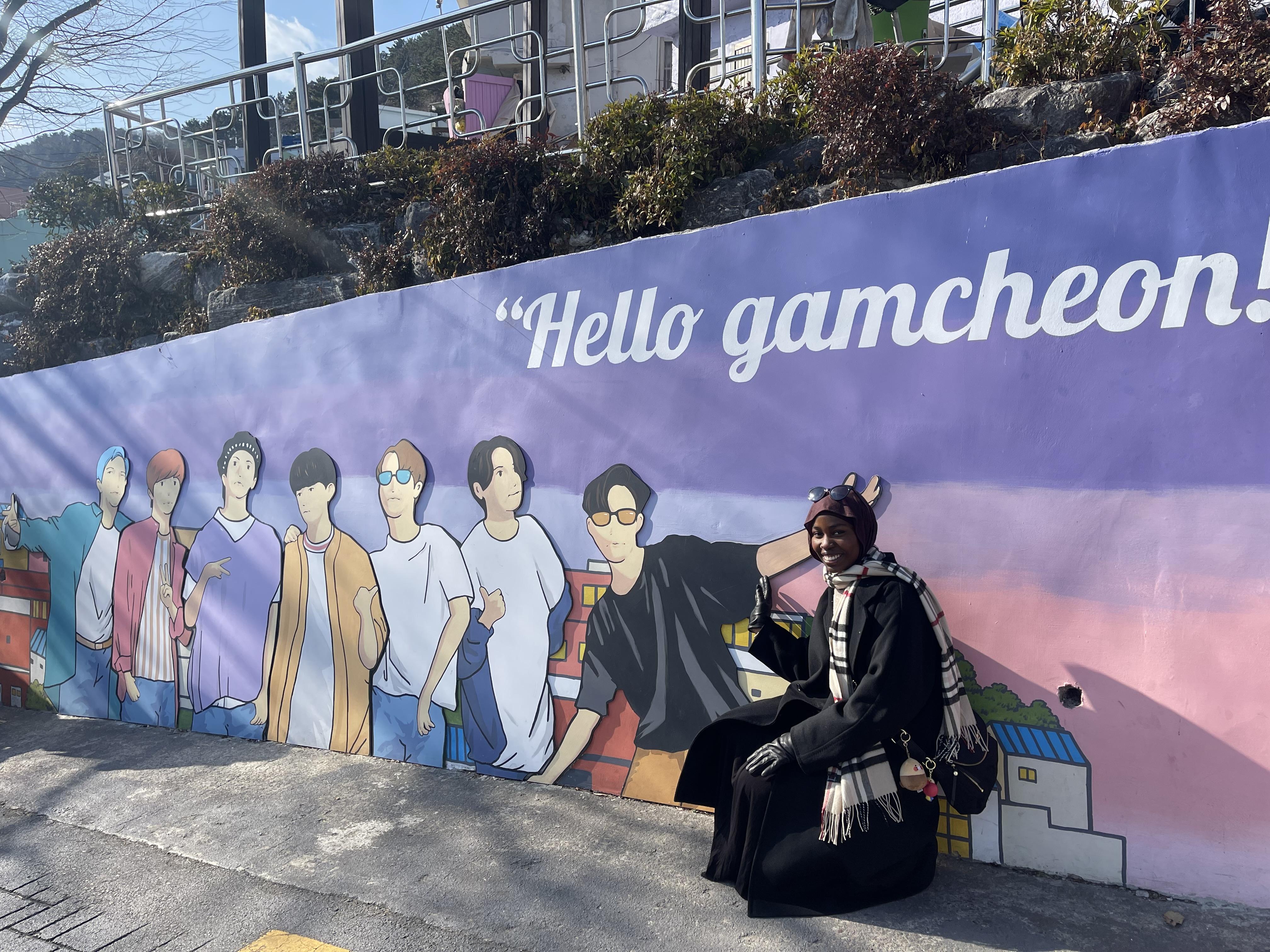 N'deye Diop '26 pictured in front of a mural in Korea. 