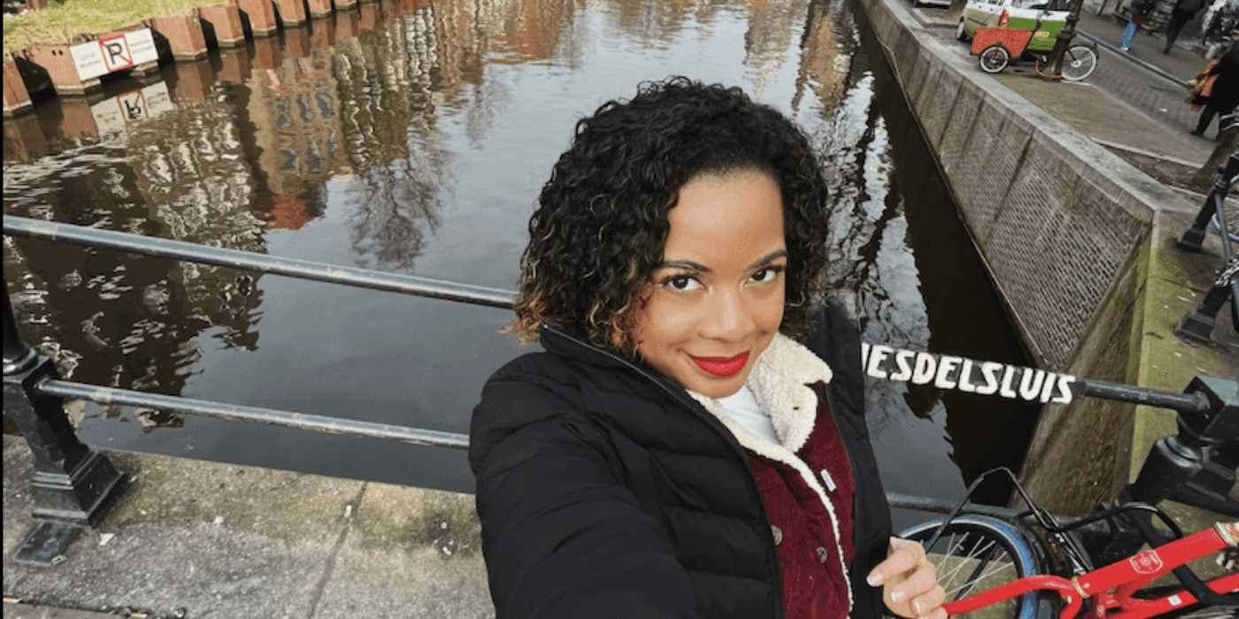 Jordan Bellamy takes a selfie by one of Amsterdam's canals.