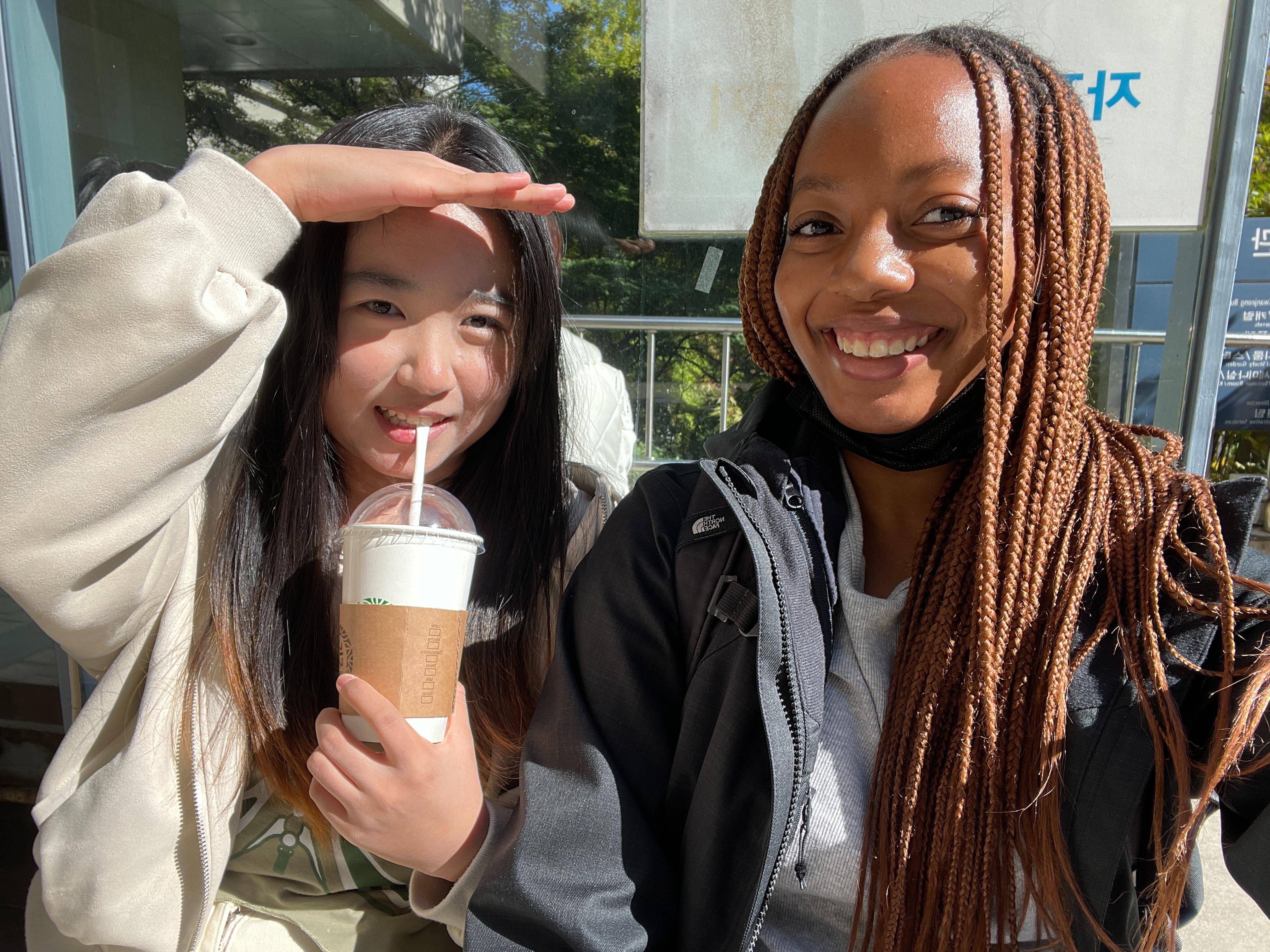 Alyssa Taylor (right) poses with a friend for a selfie. 