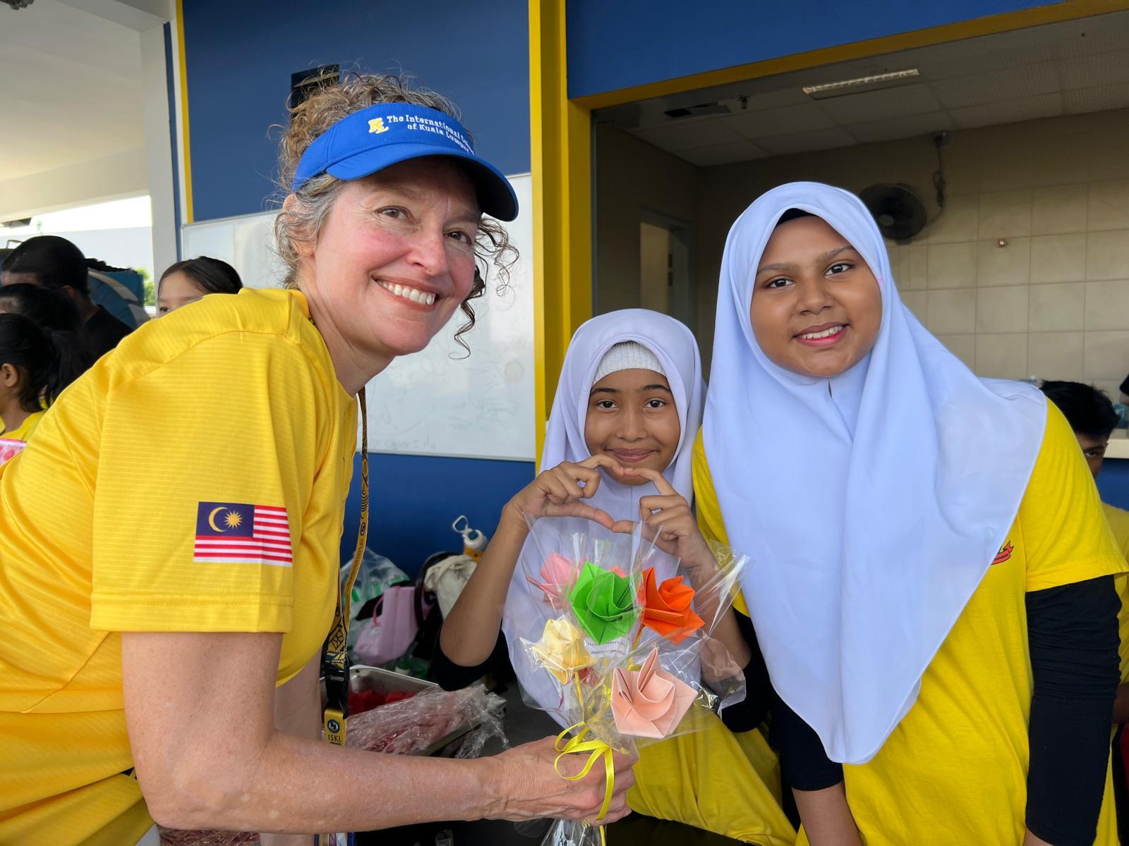 Colleen O'Neal poses with locals during her Fulbright in Malaysia. 