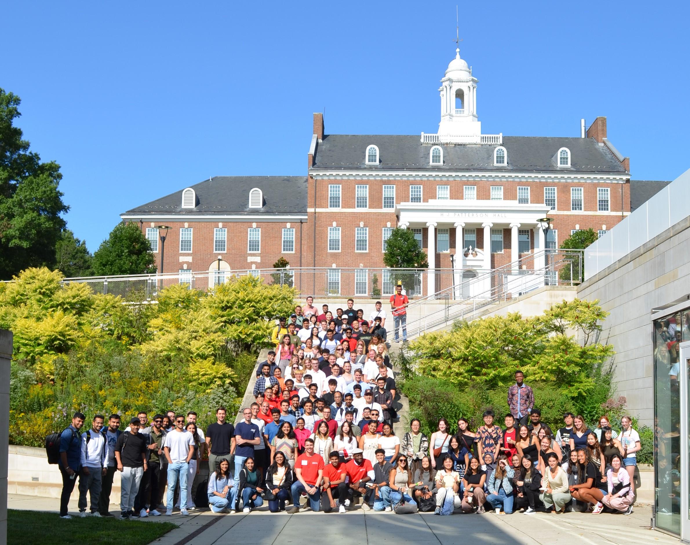 The 2024-2025 cohort of UMD international students pose outside of H.J. Patterson Hall during ISSS Fall 2024 orientation. 