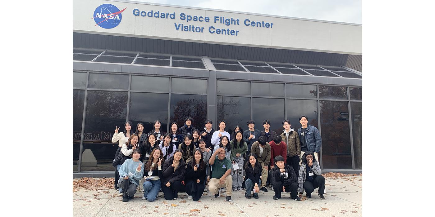 Korean STEM students pose for a group photo in front of the Goddard Space Center