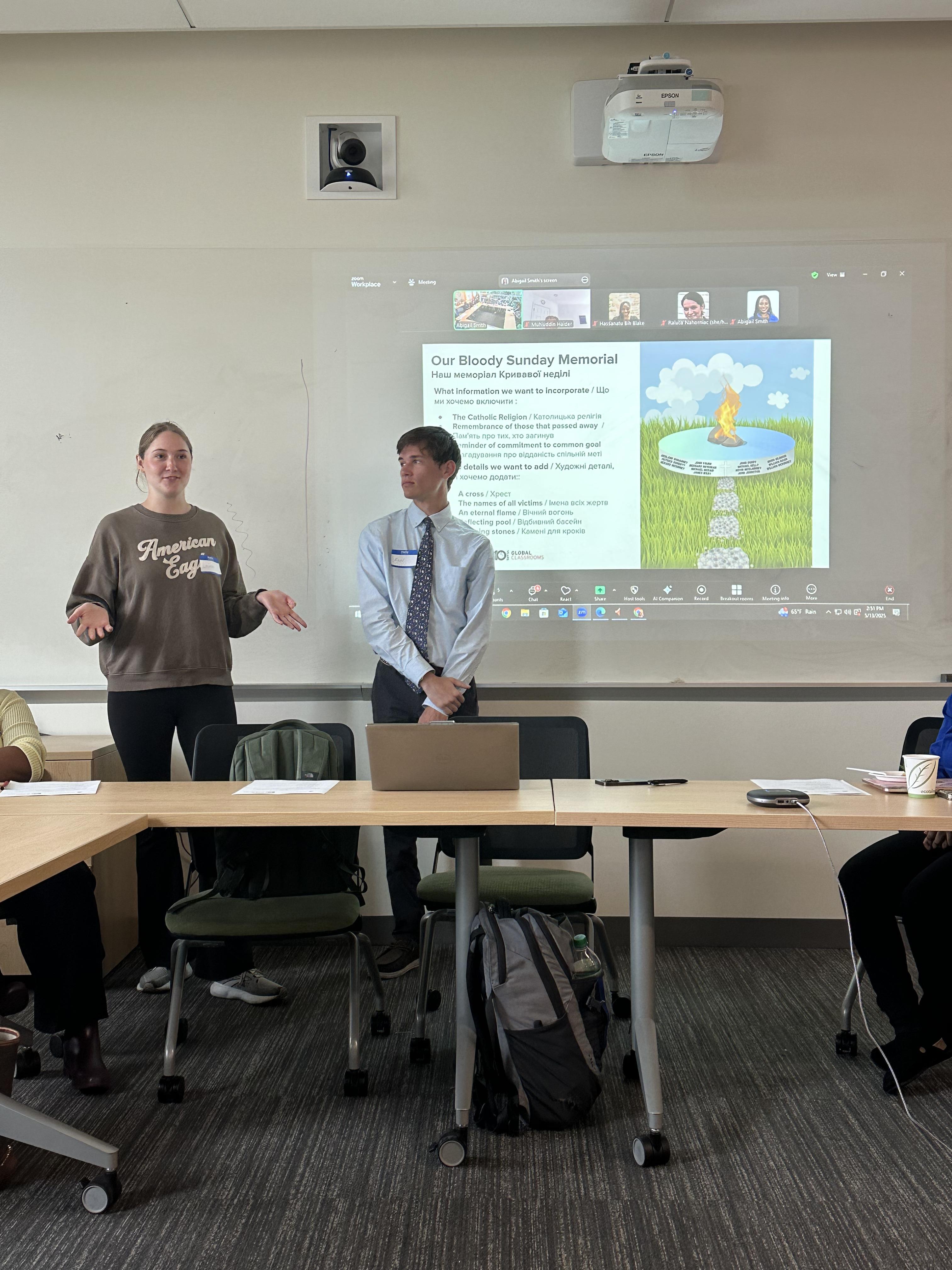 Two students give presentation on their course project
