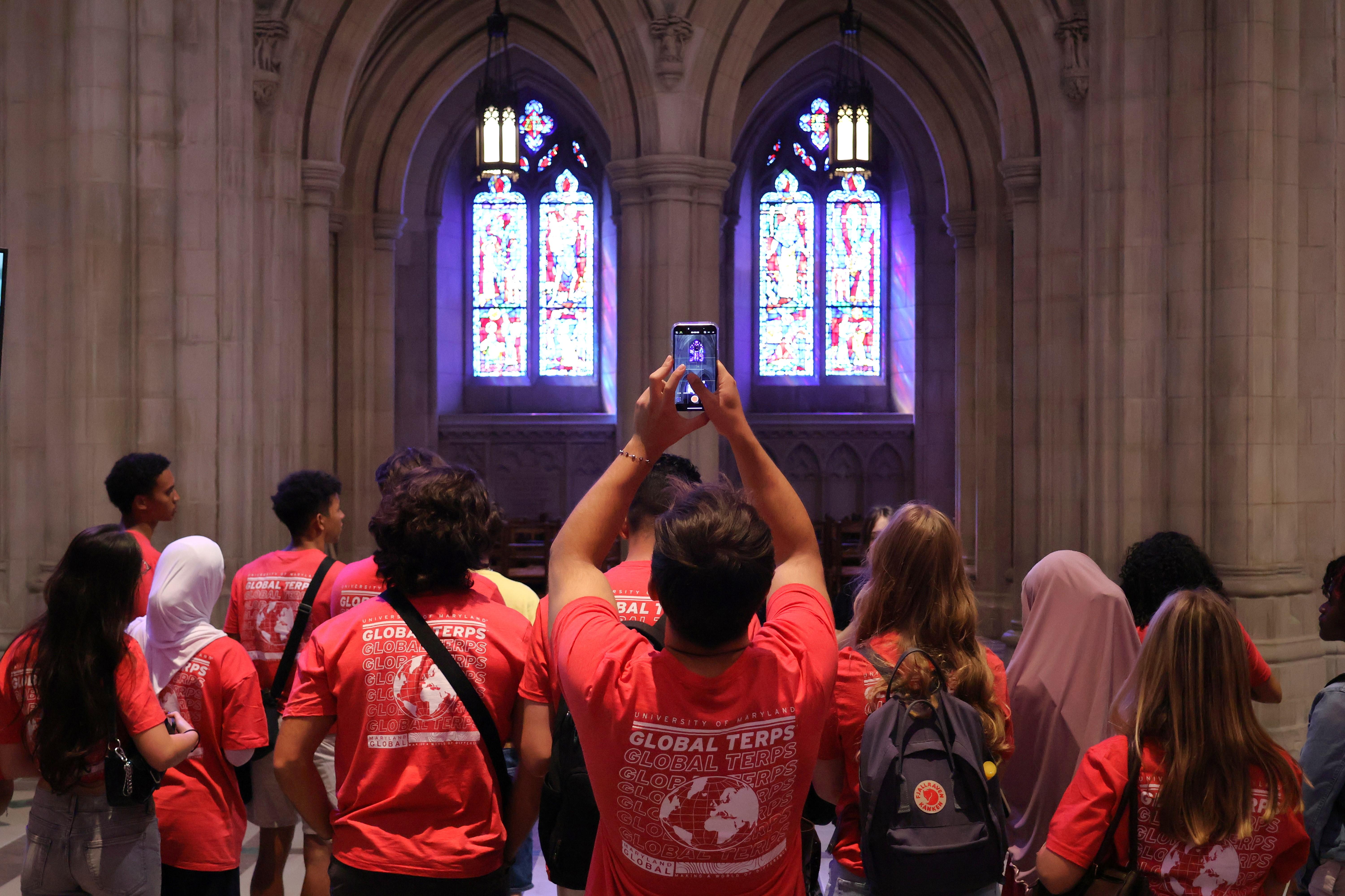 Student admiring the stained glass windows of the National Cathedral